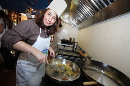Johannesburg, South Africa - October 08, 2008: Young women learning to cook and bake at a cooking classのeditorial素材