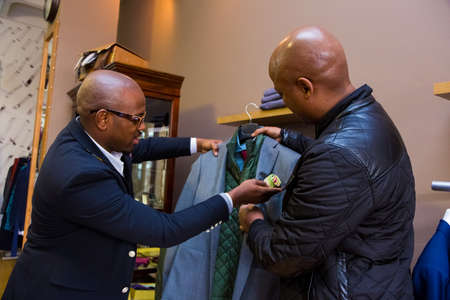 Johannesburg, South Africa - June 12 2013: Men Shopping for clothing in Upmarket Mallのeditorial素材