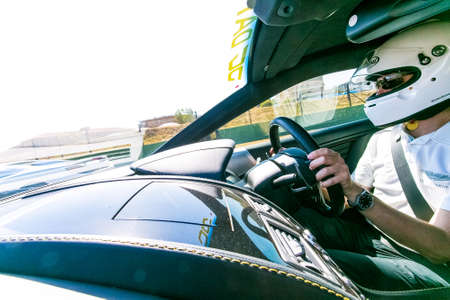 Johannesburg, South Africa - October 05 2013: Race Car Driver in an Aston Martin Sports Carのeditorial素材