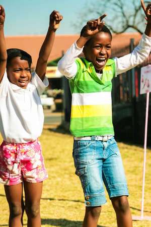 Pretoria, South Africa - August 26 2009: Diverse African Primary School children doing physical exercise PT lessonのeditorial素材