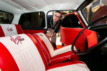 Johannesburg, South Africa - October 02, 2013: Auditor doing an inspection at Virgin Mobile Guinness...
