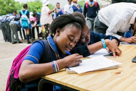 Johannesburg, South Africa - January 15, 2015: Young African primary school children writingのeditorial素材