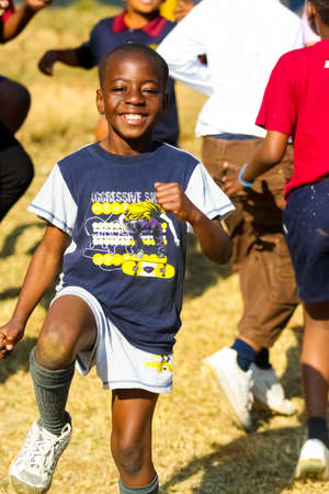 Pretoria, South Africa - August 26 2009: Diverse African Primary School children doing physical exercise PT lessonのeditorial素材