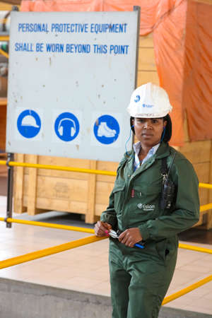 Johannesburg, South Africa - April 12 2012: Female Technician in turbine room at Coal Burning Power Stationのeditorial素材