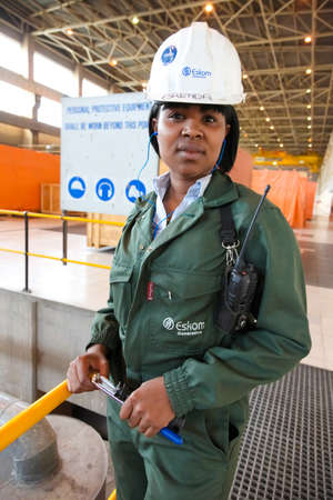 Johannesburg, South Africa - April 12 2012: Female Technician in turbine room at Coal Burning Power Stationのeditorial素材