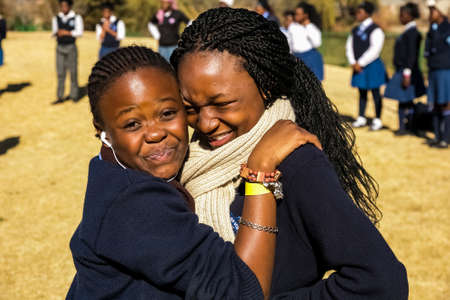 Johannesburg, South Africa - June 19, 2014: Diverse African high school pupils messing about on the sports fieldのeditorial素材