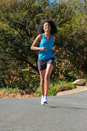 Johannesburg, South Africa - June 25 2009: Young African Girl going for a morning runのeditorial素材