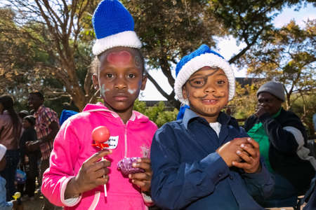 Johannesburg, South Africa - July 18, 2014: Young African Preschool kids with face paint on the playgroundのeditorial素材