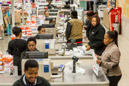 Johannesburg, South Africa - February 22, 2017: African cashiers at checkout at local Pick n Pay supermarket grocery storeのeditorial素材