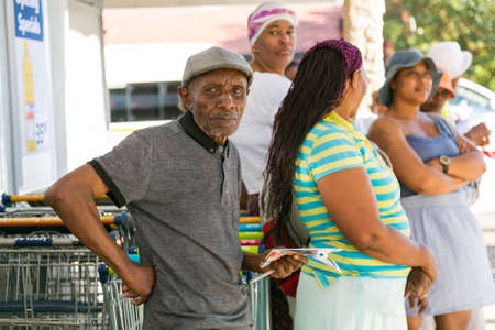 Soweto, South Africa - December 1, 2016: Customers waiting in line at entrance to local Pick n Pay grocery storeのeditorial素材