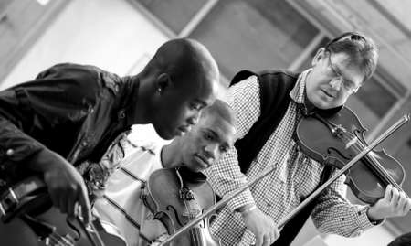 Johannesburg, South Africa - August 28 2010: Teacher at music school orchestra class