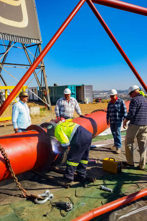Johannesburg, South Africa - June 09 2010: Tradesman working with welding torch on building siteのeditorial素材
