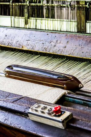 Johannesburg, South Africa - October 16, 2012: Close up of a cotton thread weft loom machine in a conveyor belt factoryのeditorial素材