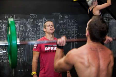 Johannesburg, South Africa - March 11, 2013: Personal Trainer giving fitness instruction at a Crossfit group classのeditorial素材
