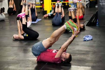 Johannesburg, South Africa - March 11, 2013: Personal Trainer giving fitness instruction at a...