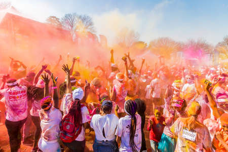 Johanneburg, South Africa,  05/21/2017, Young people having fun at The Color Run 5km Marathon, Bright color paint all over a large crowdのeditorial素材