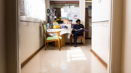 Bloemfontein, South Africa - February 25, 2015: African female nurse at old age retirement nursing home for the elderlyのeditorial素材