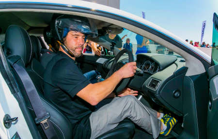Johannesburg, South Africa - October 05 2013: Jay Kay of Jamiroquai driving an Aston Martin on...