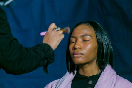 Johannesburg, South Africa - October 09 2018: Behind the Scenes Hair and Make-up on location shooting of television commercial advertのeditorial素材