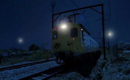 Commuter Train moving through the heart of Soweto Township at night