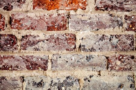 Red and purple brick and concrete texture pattern for design backgroundの写真素材