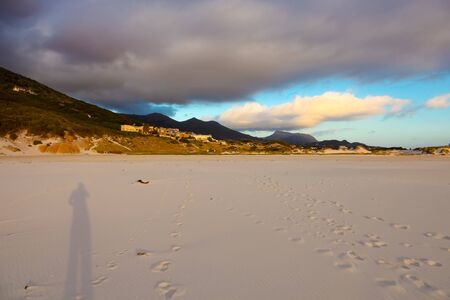Dramatic sky at sunset on Noordhoek Beach in Cape Town South Africaの写真素材