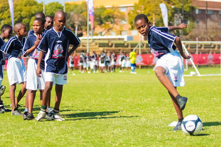 Johannesburg, South Africa - June 29 2009:  Diverse children playing soccer football at schoolのeditorial素材