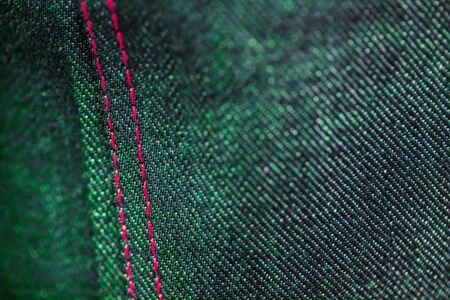 Soft Focus Macro Close up Purple and Green Denim with stitching の写真素材
