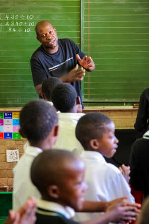 Soweto, South Africa - October 26 2011: Young African Children and Teachers in Primary School...