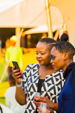 Johannesburg, South Africa - May 12 2018: Friends taking a selfie photo at food and wine festivalのeditorial素材