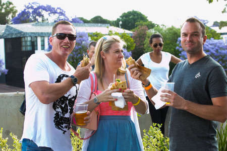 Johannesburg, South Africa - November 9 2013: Diverse Friends eating, drinking and generally enjoying a day out at a Food and Wine Fairのeditorial素材