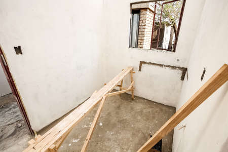 Soweto, South Africa - September 10, 2011: Interior rooms while building and painting a small low...