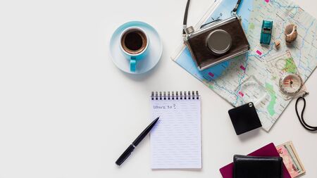 Flat Lay Top View vintage Map for planning a trip or vacation with scattered itemsの写真素材