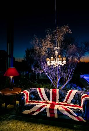 Union Jack British Flag couch with suspended chandelier at outdoor corporate eventの写真素材