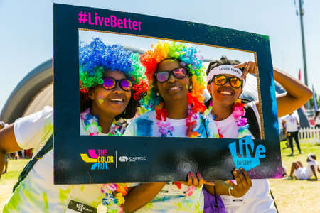 Johanneburg, South Africa,  09/25/2016, Three African girls having fun at The Color Run 5km...