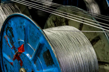 Johannesburg, South Africa - October 16, 2012: Close up view of spools of cable on a large machine...