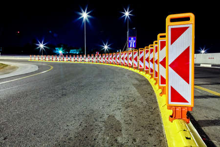Johannesburg, South Africa - October 24 2011: Motorway Signs and reflectors on Highway at nightのeditorial素材