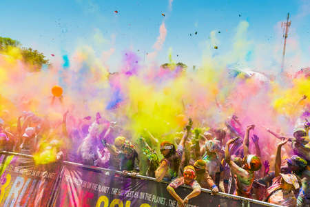 Johanneburg, South Africa,  09/25/2016, Young people having fun at The Color Run 5km Marathon, Bright color paint all over a large crowdのeditorial素材