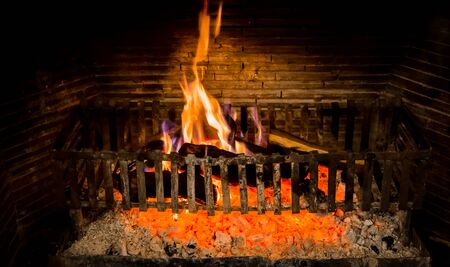 Burning logs in a Winter fireplaceの写真素材