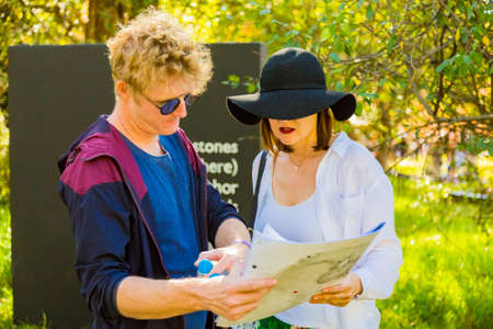 Johannesburg, South Africa - May 12 2018: A couple looking at a map in a Sculpture Park