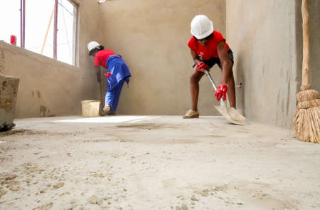 Soweto, South Africa, September 10, 2011, Diverse Community members join PWC's staff in building a low cost house as a team in Sowetoのeditorial素材