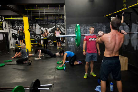 Johannesburg, South Africa - March 11, 2013: Personal Trainer giving fitness instruction at a Crossfit group classのeditorial素材