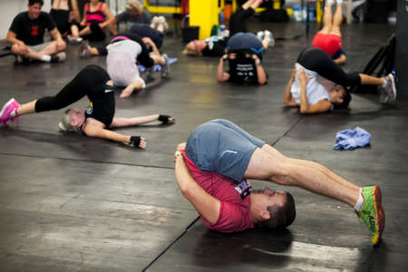 Johannesburg, South Africa - March 11, 2013: Personal Trainer giving fitness instruction at a Crossfit group classのeditorial素材