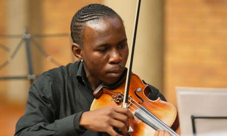 Johannesburg, South Africa - August 28 2010: Diverse youth at music school orchestraのeditorial素材