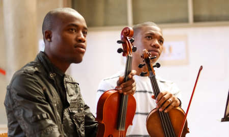 Johannesburg, South Africa - August 28 2010: Diverse youth at music school orchestraのeditorial素材