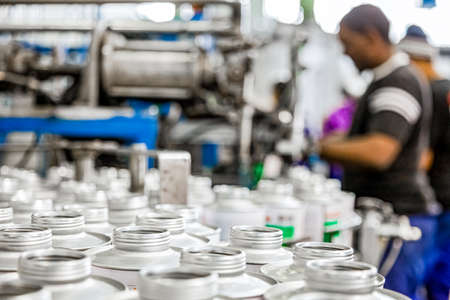 Johannesburg, South Africa - October 19, 2012: Diverse people working on an assembly line in a glue factoryのeditorial素材