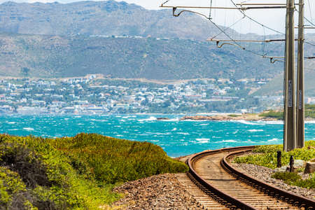Electric Passenger Railway line on the shoreline of False Bay, Cape Town South Africaの写真素材