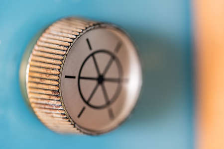 White Round plastic turning tuning knob on radiogram with steering wheel designの写真素材