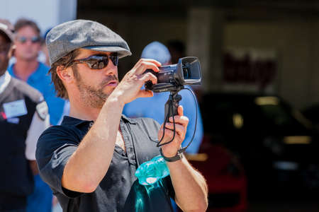 Johannesburg, South Africa - October 05 2013: Jay Kay of Jamiroquai filming on a camcorderのeditorial素材