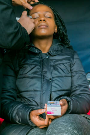 Johannesburg, South Africa - October 09 2018: Behind the Scenes Hair and Make-up on location shooting of television commercial advertのeditorial素材
